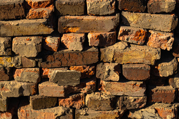 Old red brick. Construction garbage. Background and texture destruction.