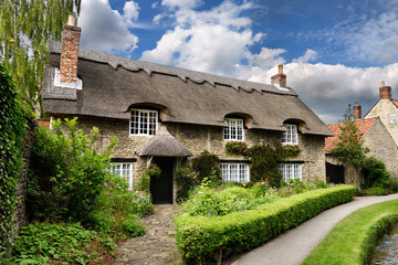 Flower garden at Beck Isle museum thatched roof cottage in Thornton-le-Dale North Yorkshire England
