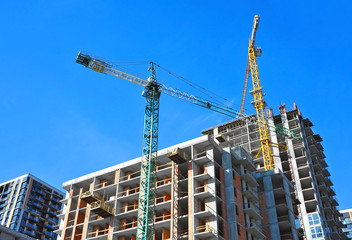 Crane and highrise construction site