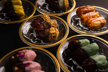 various dates on shiny crystal plates with golden design