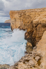 Fototapeta na wymiar Cliffs of Dwejra, location of the collapsed Azure Window on the island of Gozo, Malta