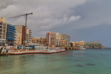 SAINT JULIANS, MALTA - NOVEMBER 11, 2017: Seaside buildings in Saint Julians town in Malta