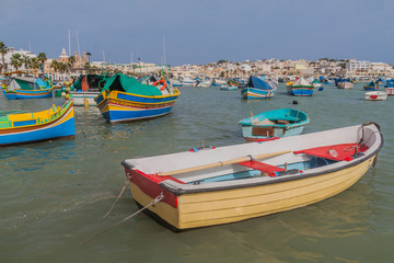 Obraz premium Fishing boats in the harbor of Marsaxlokk town, Malta