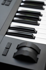 Professional midi keyboard synthesizer with knobs and controllers. Modulation and pitch wheels.