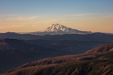 Mount Adams, active stratovolcano in the Cascade Range, Washington. Panoramic View from Sherrard Point, Fire Lookout at the top of Larch Mountain, Oregon. Sunset, Orange Sky, Mountain Silhouette