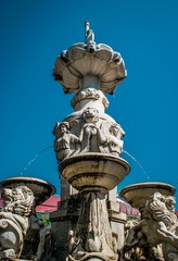 Fototapeta na wymiar Beautiful fountain under the blue sky