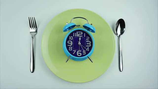 Twelve o'clock White wall clock, Rush hour eat lunch, on White Background, Time lapse moving fast.