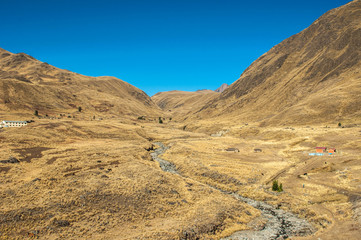 mountains and river in fall and blue sky