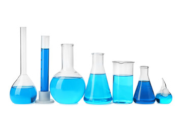Laboratory glassware with blue liquids isolated on white