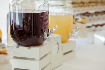 Glass jars of lemonade on wedding candy bar. Catering. Drinks on wedding party