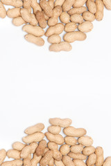 Creamy peanut butter in glass jar, peanut and spoon isolated on white background. A traditional product of American cuisine