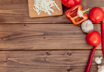 Pizza and red wine on wooden table background. Top view with copy space