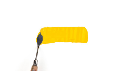 a painting palette knife isolated on a white background painting a yellow with copy space