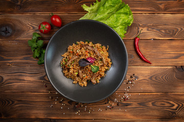 beef tahan fried Japanese rice with vegetables and slices of beef