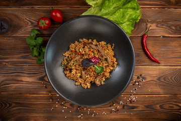 beef tahan fried Japanese rice with vegetables and slices of beef