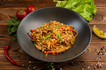 tori udon fried wheat noodles with chicken and vegetables and soy sauce