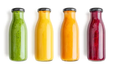 Fototapeten Green, yellow, orange and red smoothie in glass bottles © tashka2000