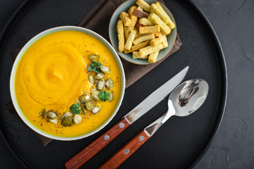 Pumpkin soup with seeds and croutons