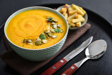 Pumpkin soup with seeds and croutons