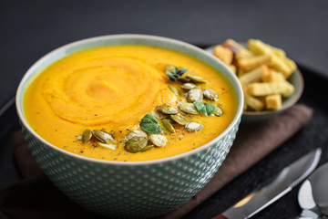 Pumpkin soup with seeds and croutons