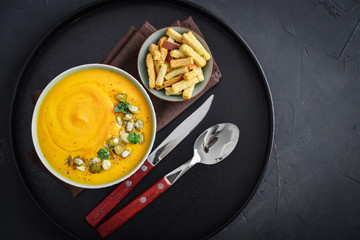 Pumpkin soup with seeds and croutons