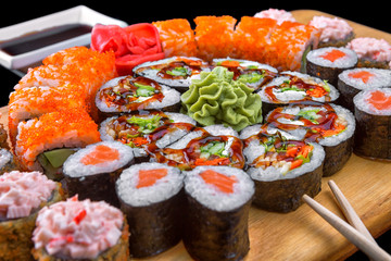 Sushi set on a wooden board. Assorted sushi