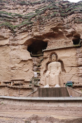 Ancient Chinese Buddha Statue at Bingling Cave Temple in Lanzhou Gansu China. UNESCO World heritage site