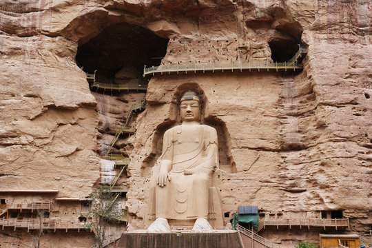 Ancient Chinese Buddha Statue at Bingling Cave Temple in Lanzhou Gansu China. UNESCO World heritage site