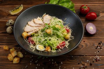 Caesar San Salad of Romano leaves, chicken, cherry tomatoes, egg, breadcrumbs, Parmesan cheese, Caesar sauce and tobiko