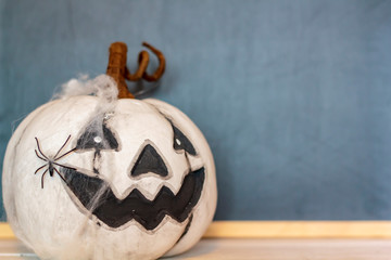 Halloween pumpkin with blackboard on the background and copy space