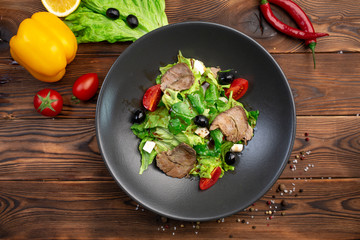 bifu sarada salad of tender slices of beef, feta cheese, cherry tomatoes and spinach leaves