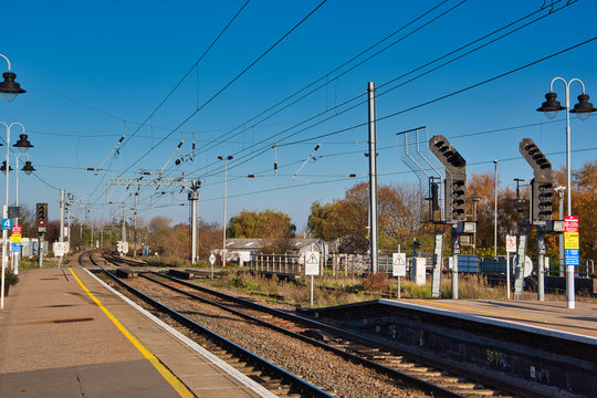 train station in uk, blue sky background