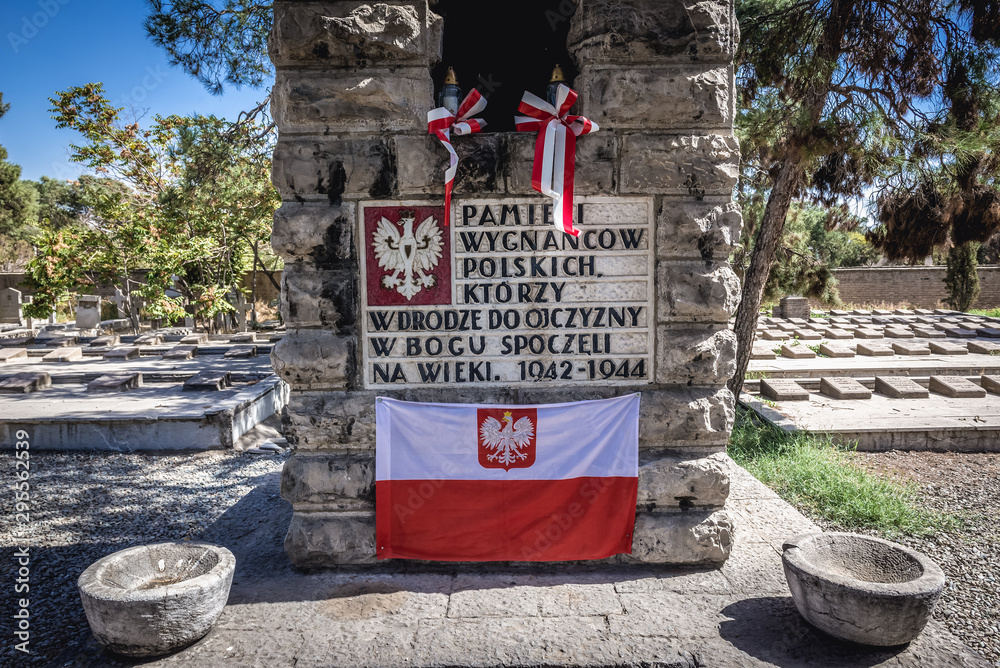 Canvas Prints Memorial board and Polish flag on the Polish refugees section of Doulab Cemetery in Tehran, Iran