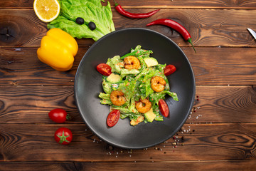 Tiger shrimp and avocado salad with spinach, iceberg and tobiko caviar with light creamy sauce