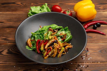 Fried wok vegetables: eggplant, carrots, mushrooms, zucchini, red onions, soy sprouts and spinach leaves fried in teriyaki sauce