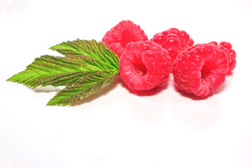 berry strawberry and raspberry with green leaves, isolated on white background.