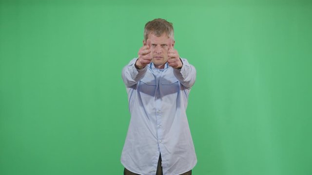 Adult Man Gun Pull Up Western Movie Style Gun Slinger. Studio Isolated Shot Against Green Screen Background