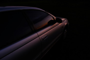 Obraz premium Beautiful car in the evening sun light. 