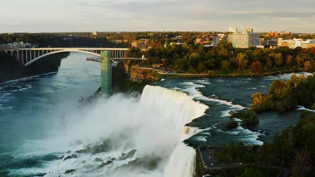 Bridges over Niagara Falls, sunset at famous destination of North America, nature of Northeast USA, fast water flow