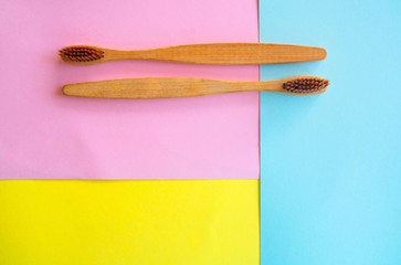 top view wooden Toothbrush on colorful paper for background .