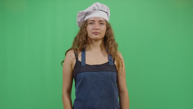 Bad Smeling Hands Expressed By A Woman Cook. Studio Isolated Shot Against Green Screen Background
