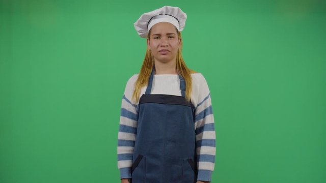 Bad Smeling Hands Expressed By A Woman Cook. Studio Isolated Shot Against Green Screen Background