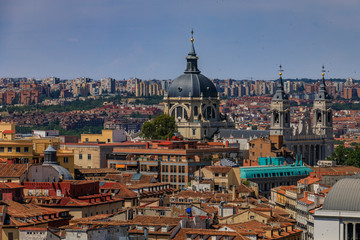 Fototapeta na wymiar Aerial view of the Madrid cityscape with Almudena Cathedral rooftops in the city center in Madrid, Spain