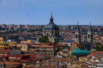 Fototapeta premium Aerial view of the Madrid cityscape with Almudena Cathedral rooftops in the city center in Madrid, Spain