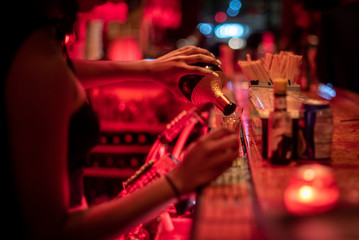 Bartender pouring shots