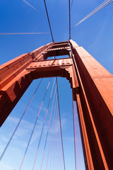 The golden gate bridge lines against a blue clear sky. San Francisco, Californiaa