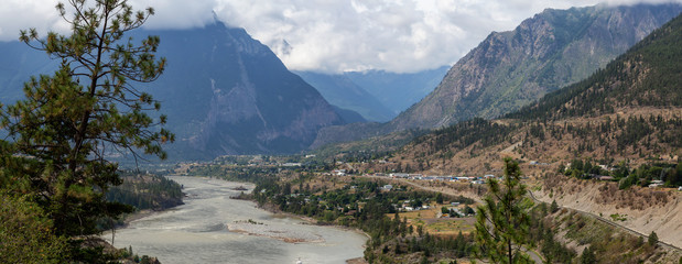 Beautiful View of a small Town, Lillooet, during a sunny and cloudy summer day. Located in the Interior British Columbia, Canada.