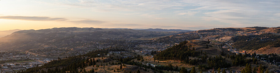 Fototapeta na wymiar Beautiful Aerial Panoramic View of a Canadian City, Kamloops, during a colorful summer sunrise. Located in the Interior British Columbia, Canada.