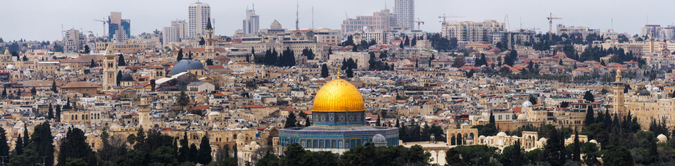 Beautiful Aerial Panoramic view of the Old City and Dome of the Rock during a sunny and cloudy day. Taken in Jerusalem, Capital of Israel.