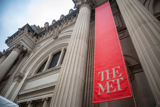 New York, Manhattan. The New York metropolitan museum, the MET entrance against blue sky background